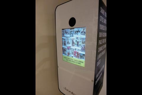 A photo booth entices shoppers upstairs